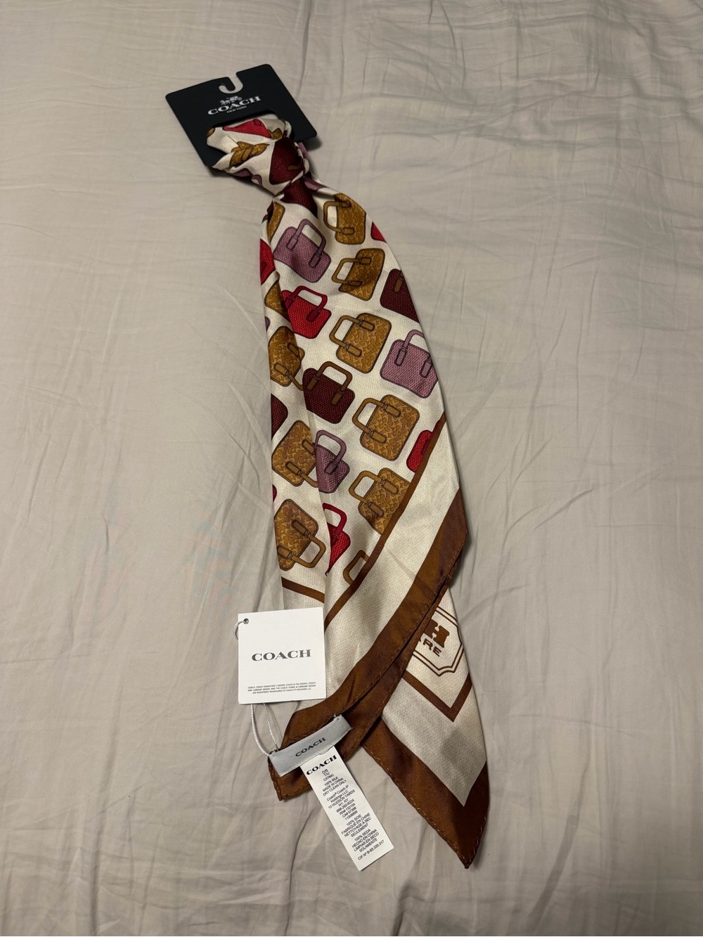 Coach Cream Scarf with Brown, Gold, Red and Pink Handbag Motif